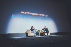 special guest and panel host on stage at Denver Film Festival