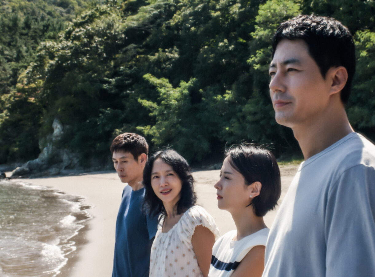 [gpt-4o]: Four people stand together on a beach, looking thoughtful